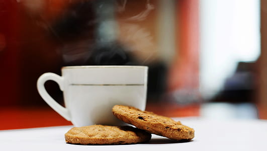 two cookies beside cup thumbnail