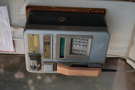 blue phone mounted on wall thumbnail