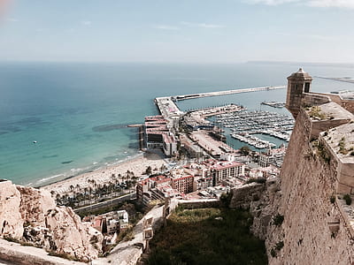 concrete buildings near sea at daytime thumbnail