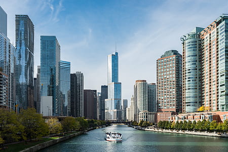 boat on water surrounded by buildings thumbnail