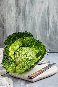 green cabbage and knife on chopping board thumbnail