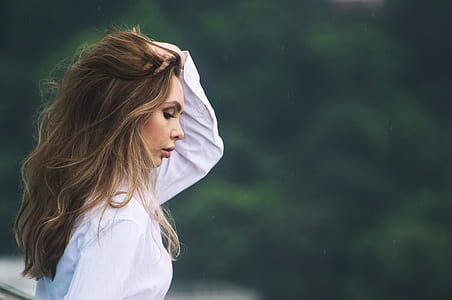 woman combing her hair thumbnail