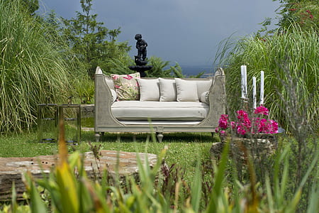 white leather sofa near green grass field thumbnail