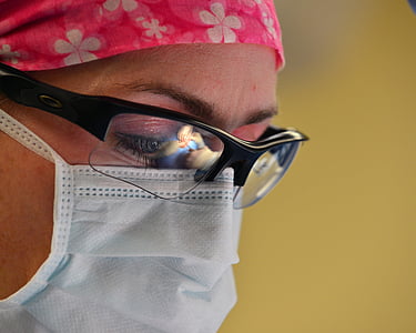 closeup photo of person wearing disposable mask thumbnail