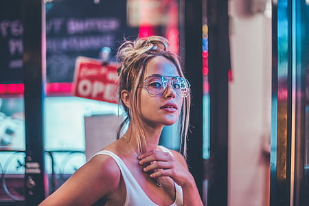 woman holding her necklace thumbnail