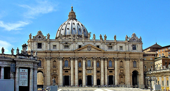 brown painted dome building under blue sky at daytime thumbnail