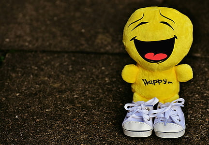 portrait photography of yellow emoji wearing pair of white shoes thumbnail