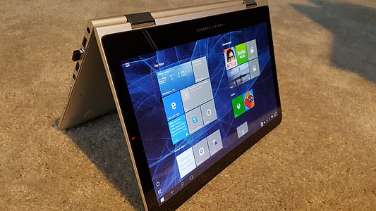 black and gray Microsoft Windows Surface turned on on brown surface thumbnail