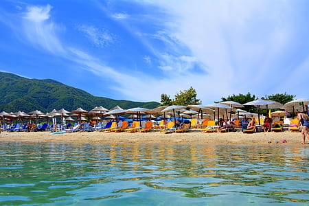 brown patio umbrellas on beach thumbnail