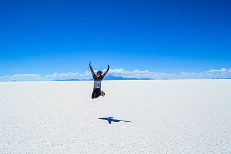 person taking jump shot on seashore thumbnail