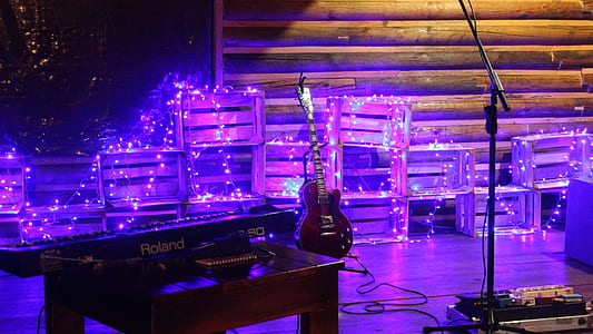 guitar and electronic keyboard placed on stage thumbnail
