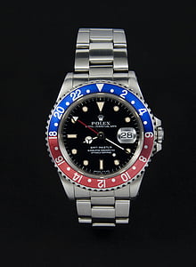 round black Rolex watch reading 8:20 thumbnail