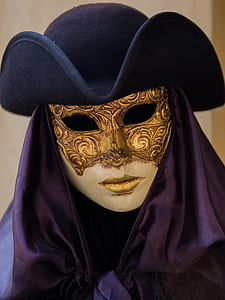 white and gold mask wearing hat thumbnail