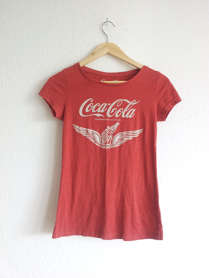 Coca-Cola shirt hanged on wall