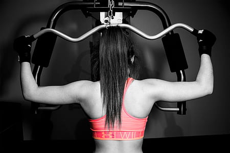 selective color photography of woman in pink sport bra thumbnail