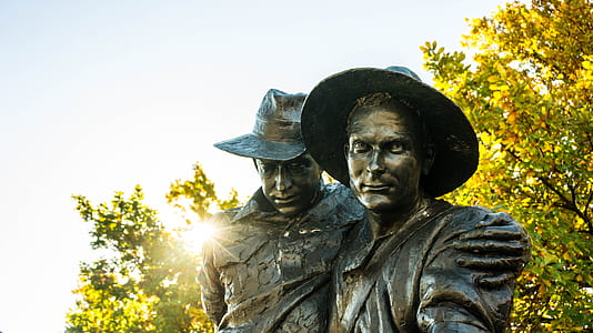 two men monument during daytime thumbnail
