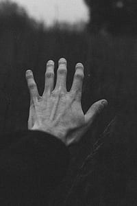 grayscale photo of left person's hand thumbnail