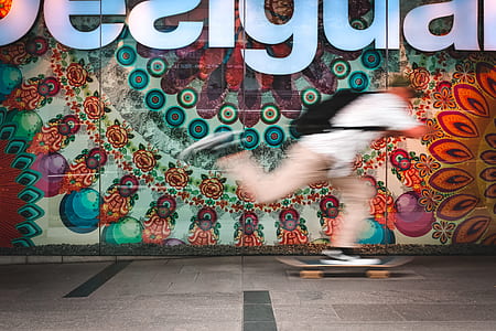 man playing skateboard near wall thumbnail
