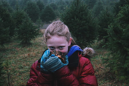 portrait photo of woman holding ball thumbnail