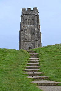 gray concrete tower beside green grass field thumbnail