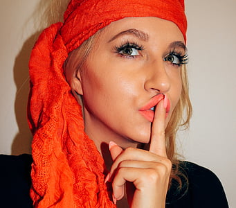woman wearing orange headscarf thumbnail