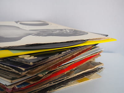 assorted record sleeves on white surface thumbnail