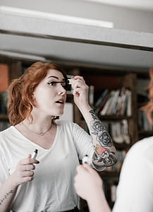 woman applying black mascara thumbnail