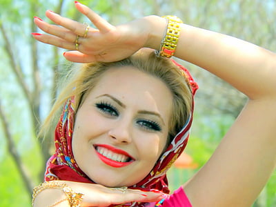 smiling woman wearing red and white hijab thumbnail