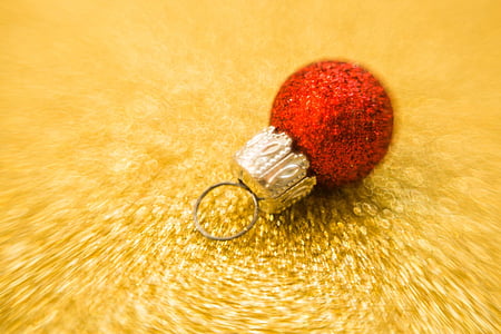 red and brown Christmas bauble on yellow surface thumbnail