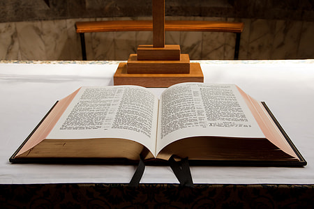 Opened bible on table thumbnail