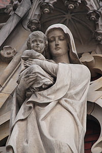 woman carrying child statue thumbnail