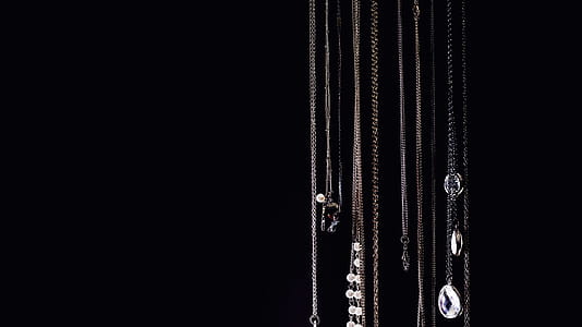 Necklaces Hanging On Black Photo thumbnail