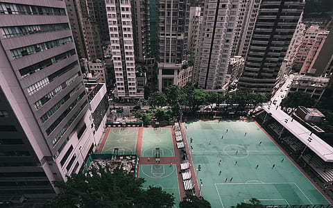 aerial view photography of soccer field surround buildings thumbnail