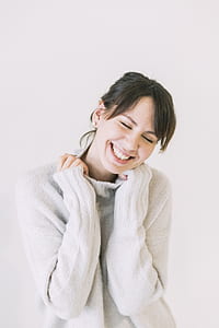 Woman Wearing White Turtle-neck Sweater thumbnail