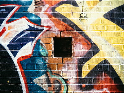 window in wall with multicolored graffiti thumbnail