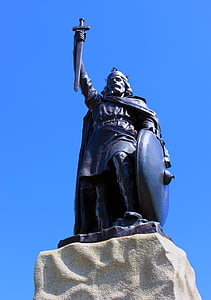 man holding shield and sword statue photo thumbnail