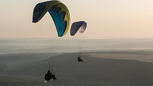 two persons riding on a paragliding thumbnail