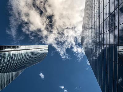 low-angle photo of concrete high-rise building at daytime thumbnail