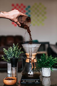 person pouring coffee powder thumbnail