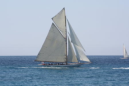 white sailboat on body of water thumbnail