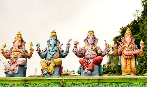 four Ganesha statues at daytime thumbnail