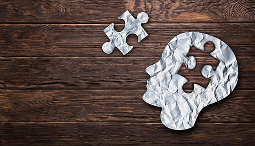 Solving a Problem - Concept With Crumpled Paper Head Silhouette thumbnail