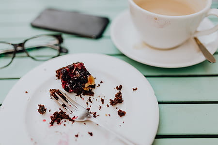 Drinking coffee and eating cake in a cafeteria thumbnail