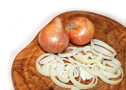 close-up photo of white onion bulbs on chopping boar thumbnail