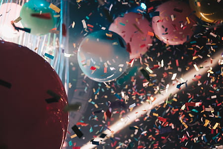 low angle view photography of confetti and balloons thumbnail