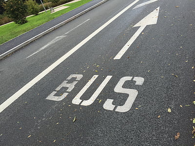 gray concrete road with bus text pointing up thumbnail