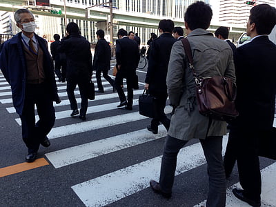 people crossing the pedestrian during daytime thumbnail