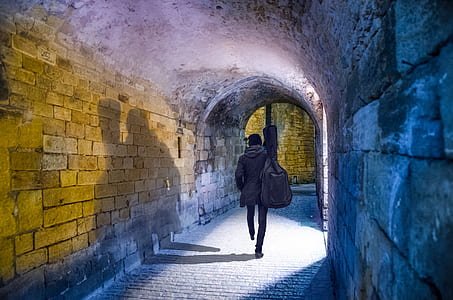 person walking in tunnel wallpaper thumbnail