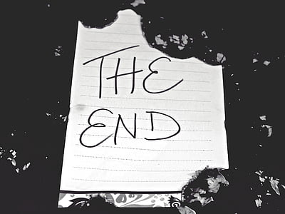 white printer paper with the end text on black surface thumbnail