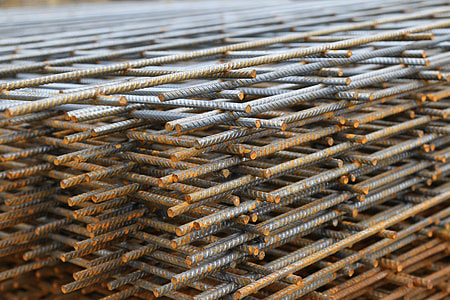 selective focus photography of stack of gray metal rod lot thumbnail